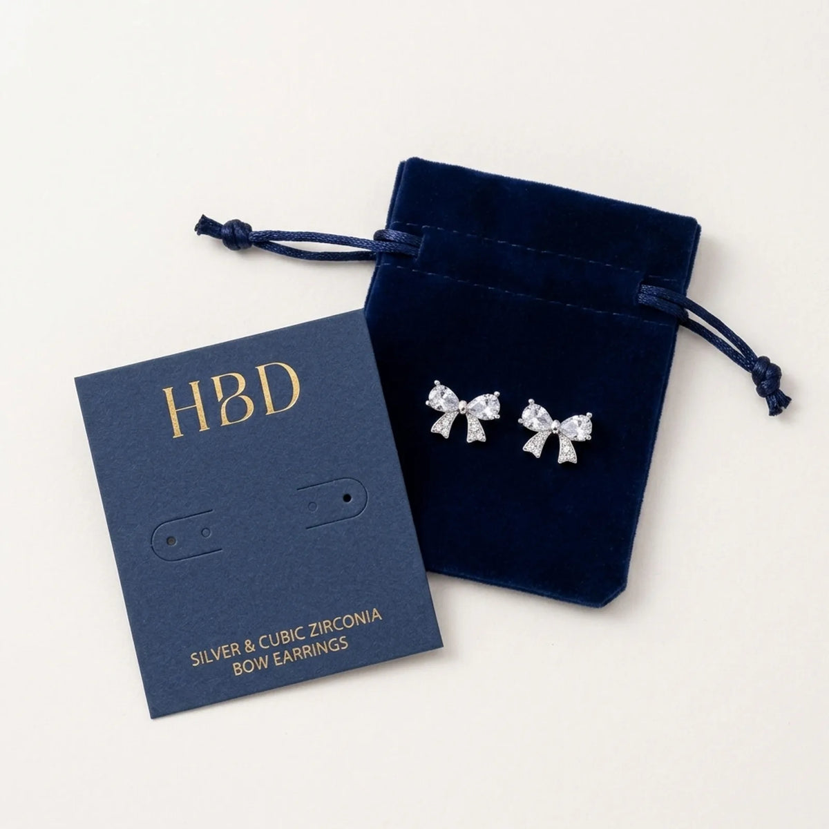 Bow Stud Earrings — Packaging Flat Lay