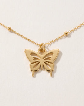 Collana e bracciale con ciondolo a farfalla