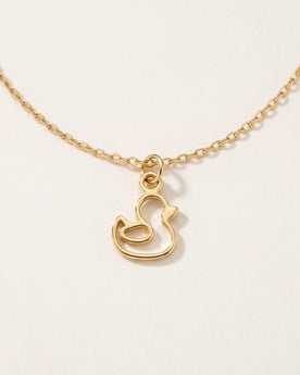 Collana e bracciale con ciondolo a forma di anatra