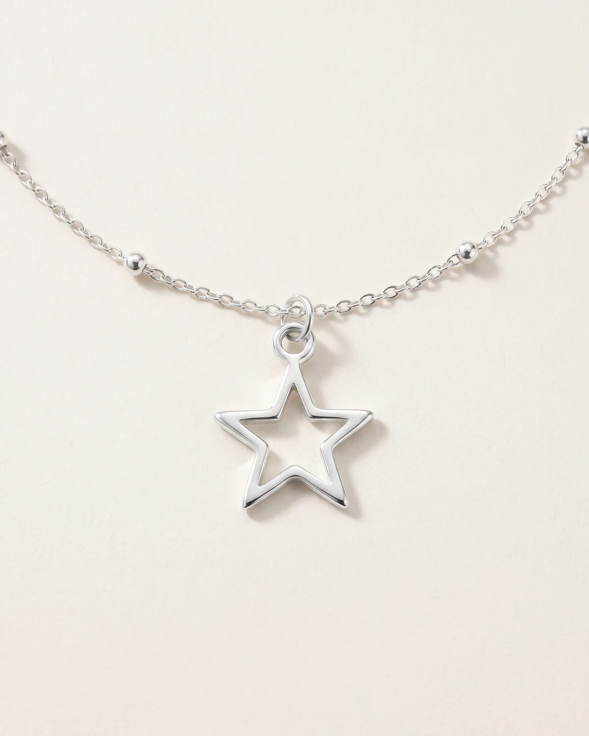 Free gift Hollow Star Charm in silver on a satellite chain