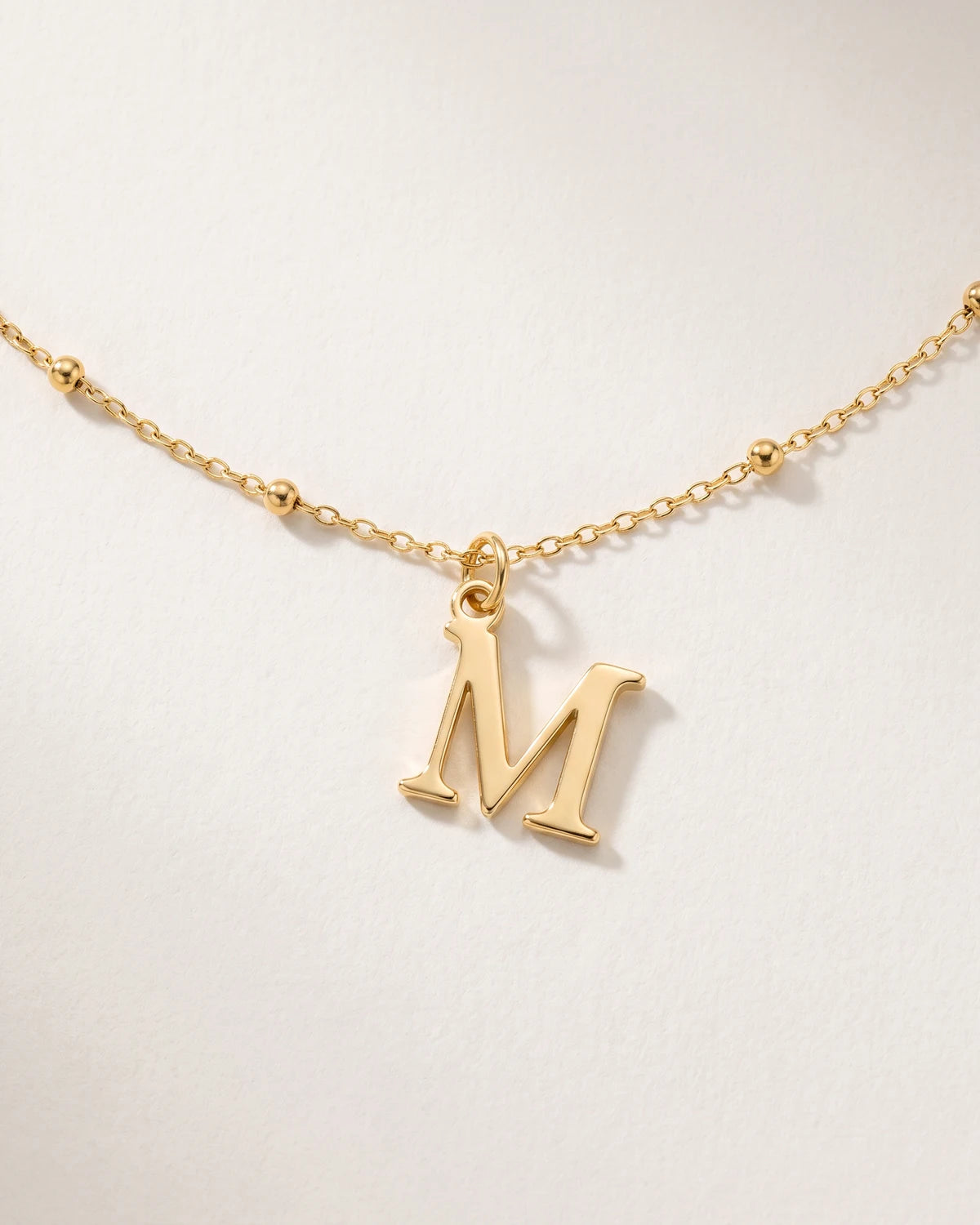 Free gift Letter M in gold on a satellite chain