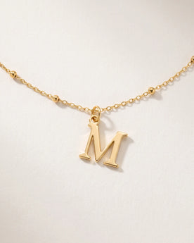 Free gift Letter M in gold on a satellite chain