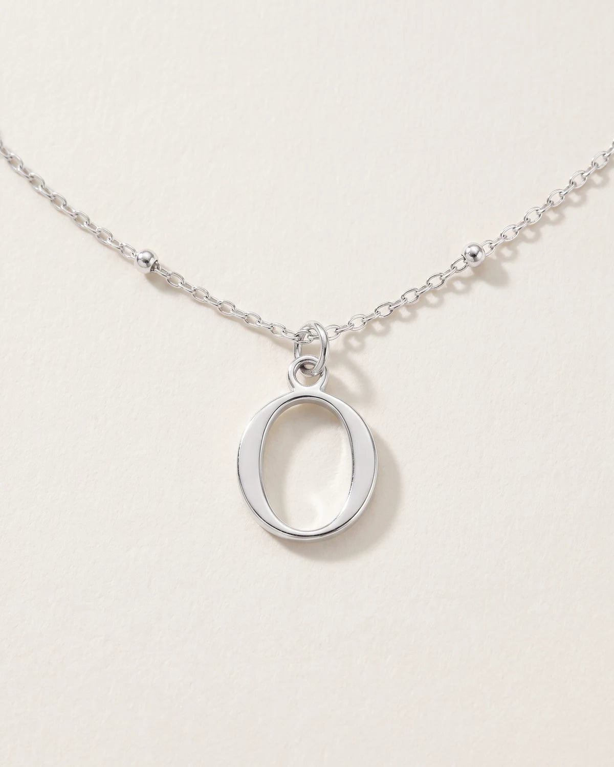 Free gift Letter O in silver on a satellite chain