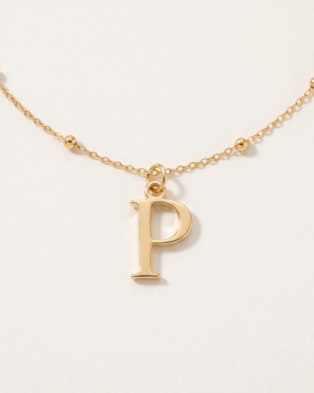 Free gift Letter P in gold on a satellite chain
