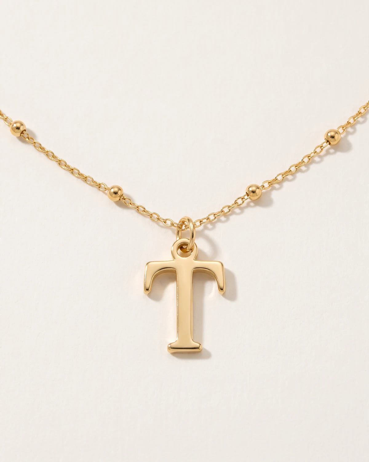 Free gift Letter T in gold on a satellite chain