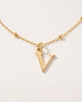 Free gift Letter V in gold on a satellite chain