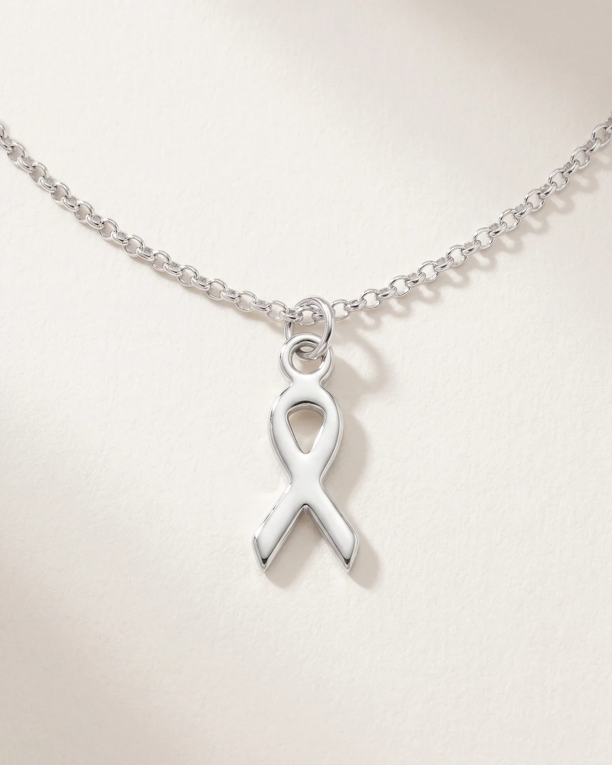 Free gift Ribbon Charm in silver on a belcher chain