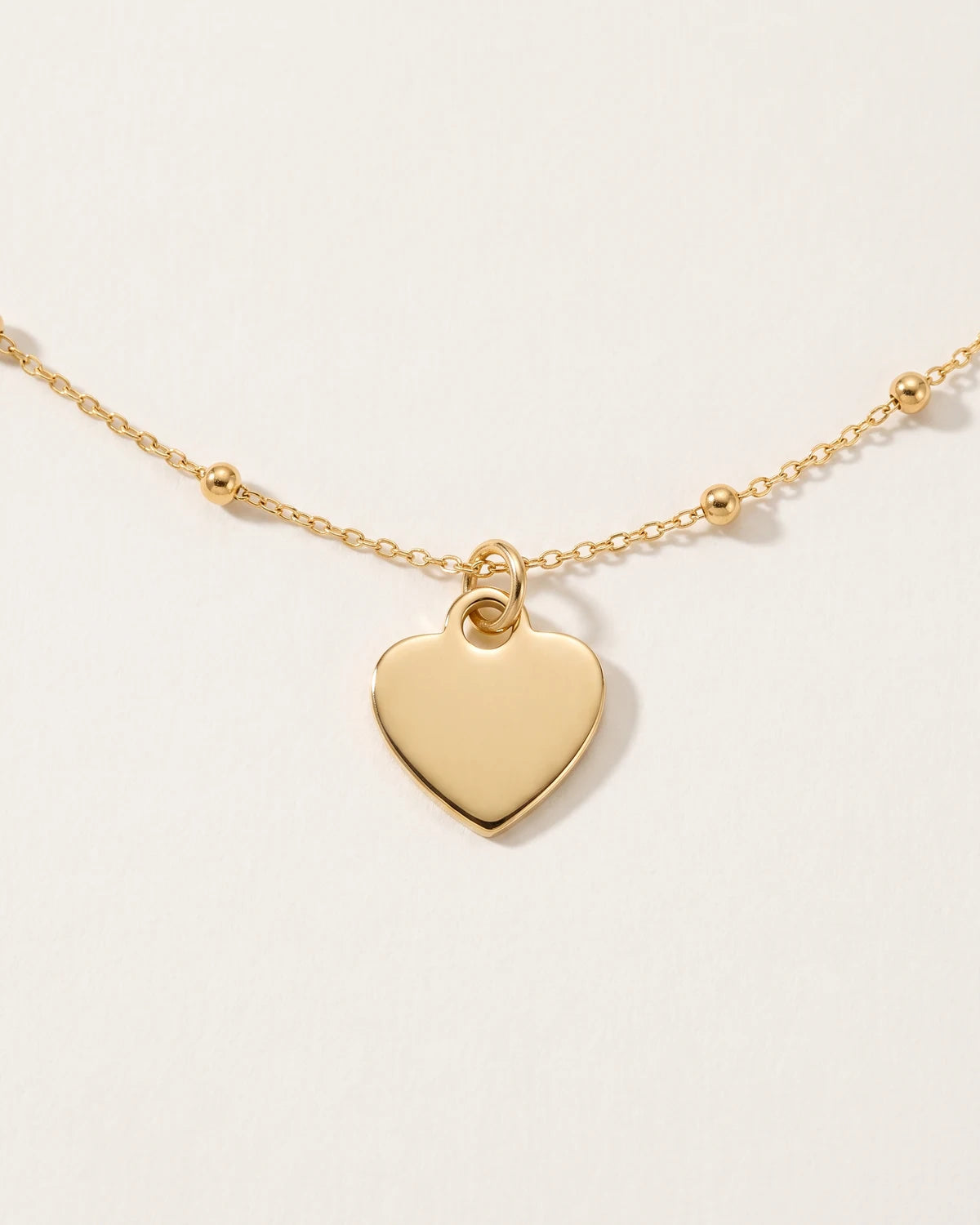 Halsband och armband med massivt hjärta berlock