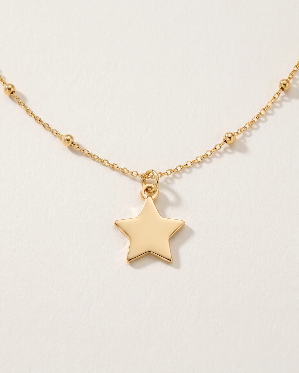 Free gift Star Charm in gold on a satellite chain
