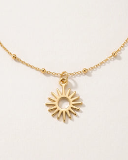 Collana e bracciale con ciondolo a forma di sole