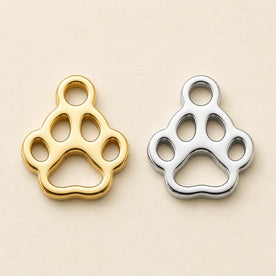 Gold and silver pet paw charms for a personalised name necklace