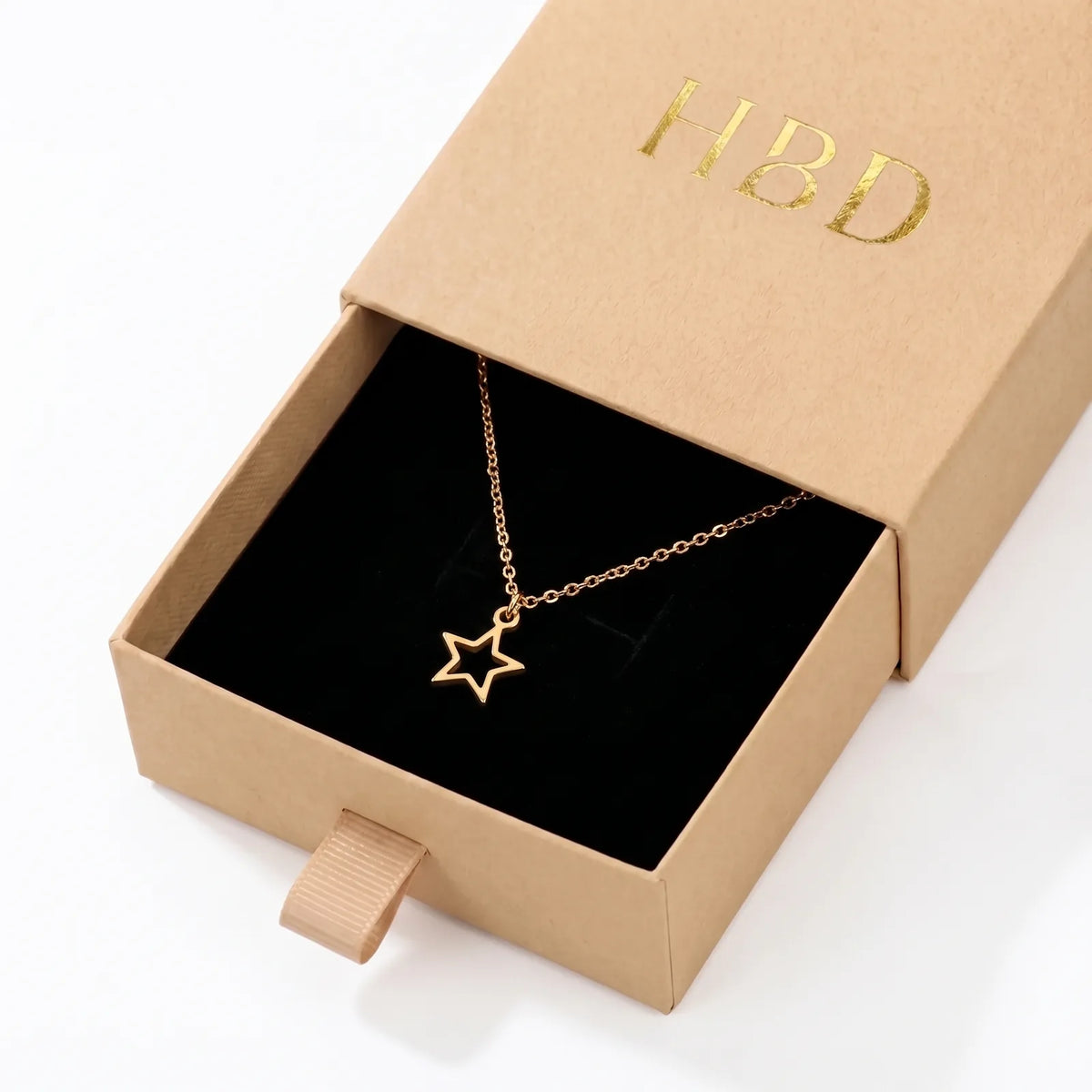 Collar y pulsera con dije de estrella hueca