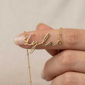 Necklace Lyla Name Necklace HBD: Held, for scale