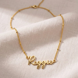 Collier prénom Reggie | Or 18 carats, argent et vermeil | Prêt à être expédié