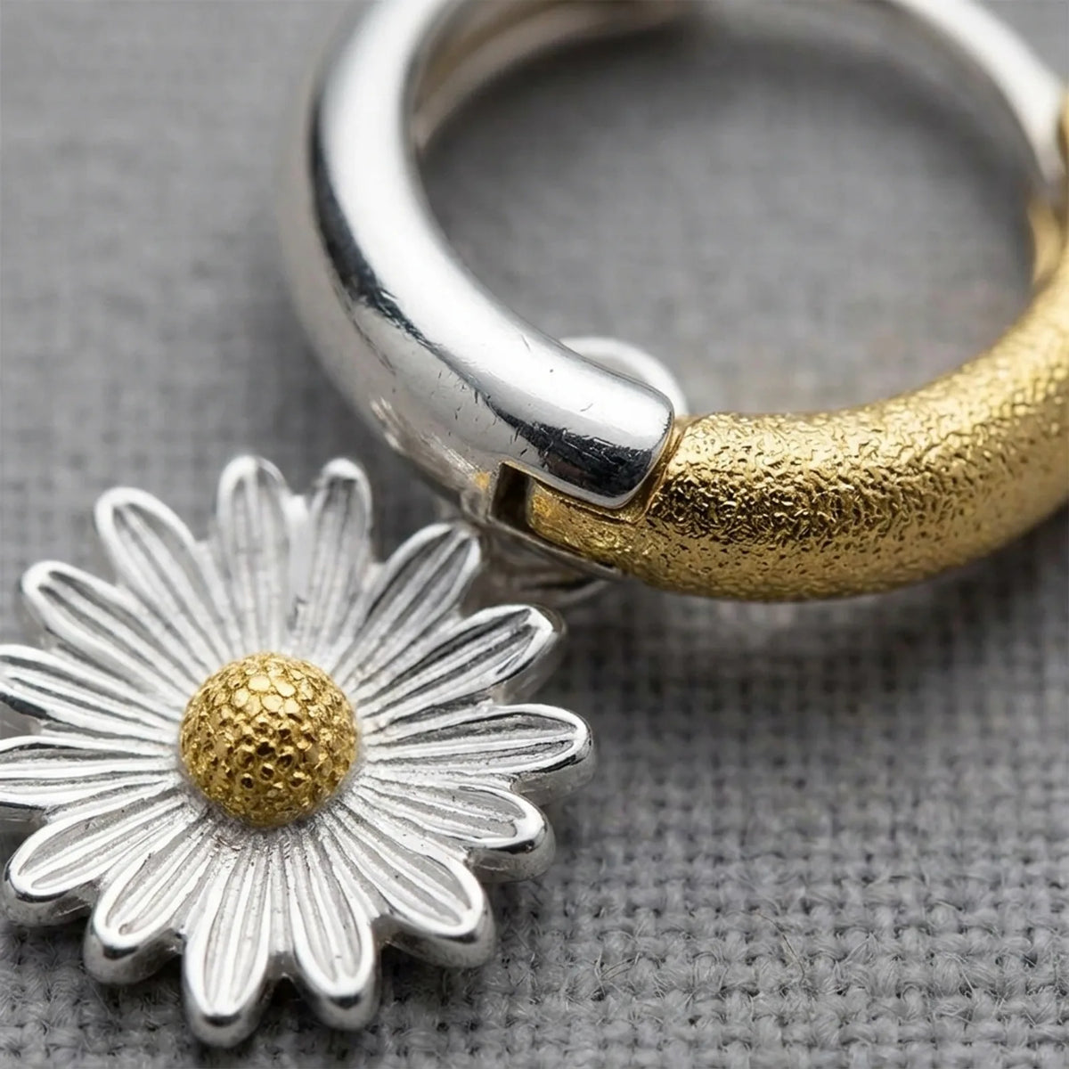Two-tone Daisy Charm Huggie Hoop Earrings — Daisy Charm Close-Up